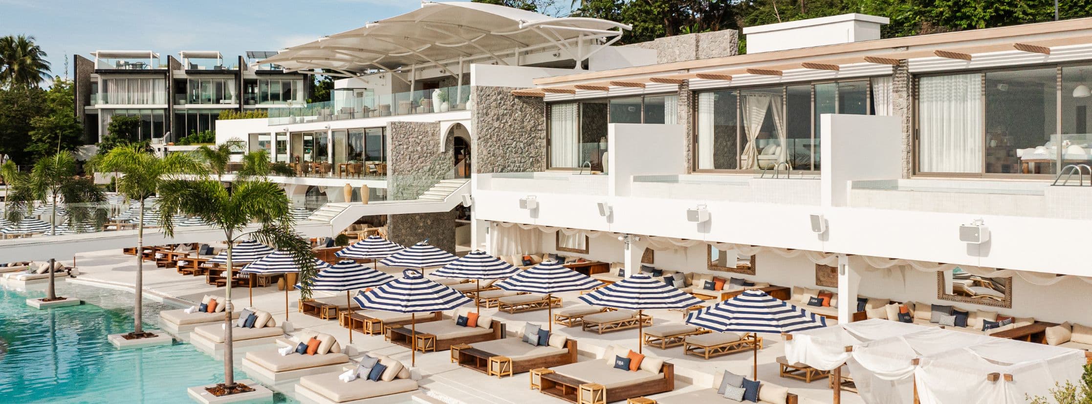 Fira Beach Club Phuket delivers an unparalleled beachside experience with a state-of-the-art Void Acoustics sound system powered by a fully networked Dante Audio and Allen & Heath AHM backbone. Designed and installed by Aura Visual System, the multi-zone setup ensures pristine, uniform audio across every space – from the vibrant pool deck to elegant VIP rooms – with flexible routing, precise zone control, and weather-resistant performance perfectly suited to Phuket’s coastal climate.